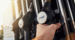 hand reaching for diesel fuel